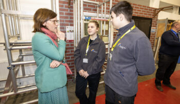 Alex Baker MP with students at the Aldershot Construction College
