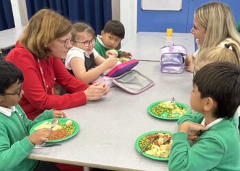 Alex Baker MP with children at Farnborough Grange Nursery and Infant Community School